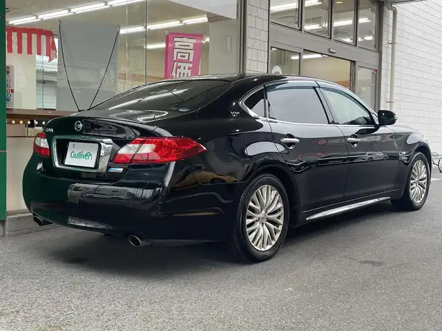 日産 シーマ ハイブリッド VIP 愛知県 2014(平26)年 11.9万km スーパーブラック サンルーフ/レザーシート/前席シートヒーター/前席シートベンチレーション/前席シパワーシート/運転席メモリシート/助手席オットマン/メーカーナビ/・地デジテTV/DVD/バックカメラ/ETC/レーダークルーズコントロール/左右独立エアコン/純正18インチAW/社外AWスタッドレスタイヤ積み込み（245/50/R18）/スペアタイヤ/HIDヘッドランプ/電動リヤサンシェード/スマートキー＆プッシュスタート/電動チルトステアリング