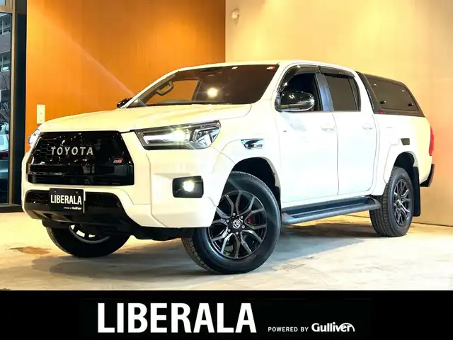 トヨタ ハイラックス Z GRスポーツ 富山県 2022(令4)年 2.8万km スーパーホワイトⅡ AERO KLAS製キャノピー/Bi-BeamLEDヘッドランプ/パノラミックビューモニター/レーダークルーズコントロール/ブリクラッシュセーフティ/レーンディパーチャーアラート/専用18インチAW/スタッドレスタイヤAWセット/ハーフレザーシート/クリアランスソナー