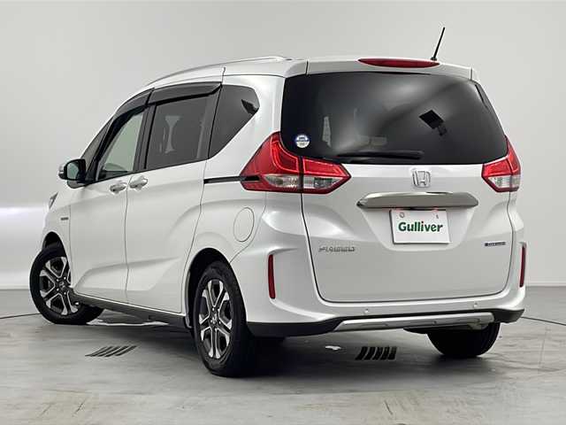 ホンダ フリード ハイブリット クロスター ホンダセンシング 愛知県 2021(令3)年 4.8万km プラチナホワイトパール 禁煙車/ワンオーナー/純正ディーラーナビ/（AM/FM/CD/DVD/BT/フルセグ/MUSIC RACK）/オートリトラミラー/両側パワースライドドア/革巻きステアリング/ステアリングスイッチ/ETC/バックカメラ/純正ドライブレコーダー前後/追従型クルーズコントロール/ハーフレザーシート/前席シートヒーター/衝突軽減システム/ビークルスタビリティアシスト/車線維持支援システム/チルト＆テレスコピックステアリング/ECON/純正ドアバイザー/純正フロアマット/ウィンカーミラー/シートリフター/オートライト/オートマチックハイビーム/フォグランプ/取扱説明書/保証書