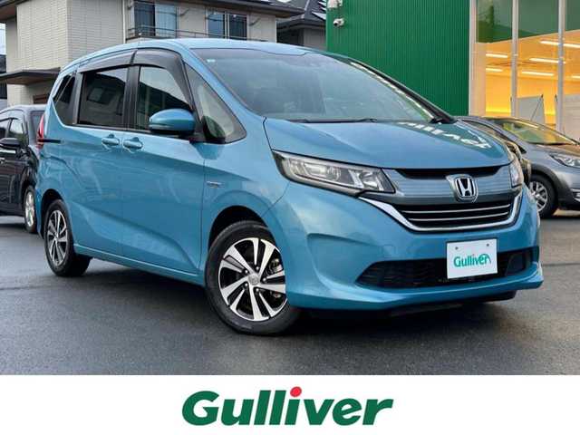 ホンダ フリード＋ ハイブリット G ホンダセンシング 静岡県 2017(平29)年 2.5万km 青 エンジンスタートボタン/パワーステアリング/パワーウィンドウ/アイドリングストップ/オートエアコン/クルーズコントロール追従走行/Bluetooth/ETC/バックカメラ/SDナビ/TV（フルセグ、地デジ視聴可）/ハーフレザーシート/両側パワースライドドア/純正アルミホイール/ABS/横滑り防止装置/レーンキープアシスト/オートライト/Wエアバッグ/衝突軽減システム