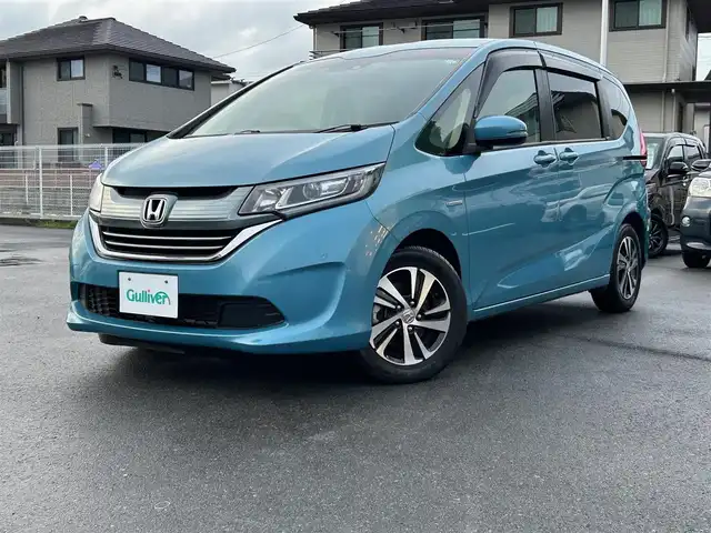 ホンダ フリード＋ ハイブリット G ホンダセンシング 静岡県 2017(平29)年 2.5万km 青 エンジンスタートボタン/パワーステアリング/パワーウィンドウ/アイドリングストップ/オートエアコン/クルーズコントロール追従走行/Bluetooth/ETC/バックカメラ/SDナビ/TV（フルセグ、地デジ視聴可）/ハーフレザーシート/両側パワースライドドア/純正アルミホイール/ABS/横滑り防止装置/レーンキープアシスト/オートライト/Wエアバッグ/衝突軽減システム