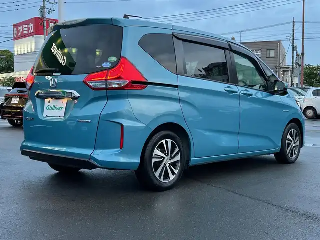 ホンダ フリード＋ ハイブリット G ホンダセンシング 静岡県 2017(平29)年 2.5万km 青 エンジンスタートボタン/パワーステアリング/パワーウィンドウ/アイドリングストップ/オートエアコン/クルーズコントロール追従走行/Bluetooth/ETC/バックカメラ/SDナビ/TV（フルセグ、地デジ視聴可）/ハーフレザーシート/両側パワースライドドア/純正アルミホイール/ABS/横滑り防止装置/レーンキープアシスト/オートライト/Wエアバッグ/衝突軽減システム