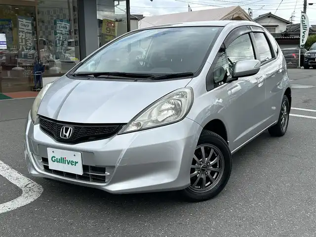 ホンダ フィット G 長野県 2011(平23)年 2万km アラバスターシルバーメタリック 社外スタッドレスタイヤ積み込み/ドアバイザー/純正オーディオ/バックカメラ/ABS/盗難防止装置
