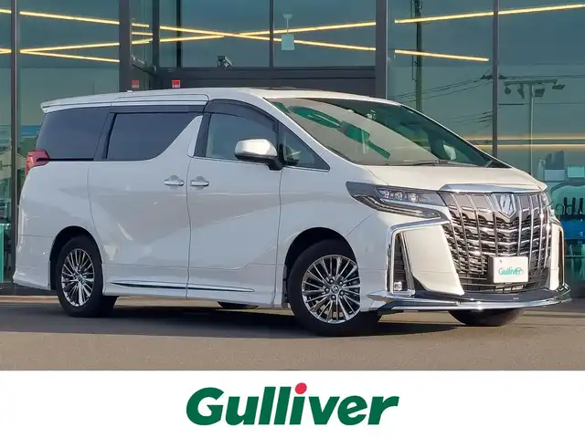 トヨタ アルファードハイブリット エグゼクティブ ラウンジ S 東京都 2022(令4)年 1.6万km ホワイトパールクリスタルシャイン メモリナビ/バックカメラ/フリップダウンモニター/アイドリングストップ/ウィンカーミラー/オットマン/キャプテンシート/クルーズコントロール/サンルーフ/ドアバイザー/プッシュスタート/両側パワースライドドア/パワーバックドア/イージークローザー/ETC