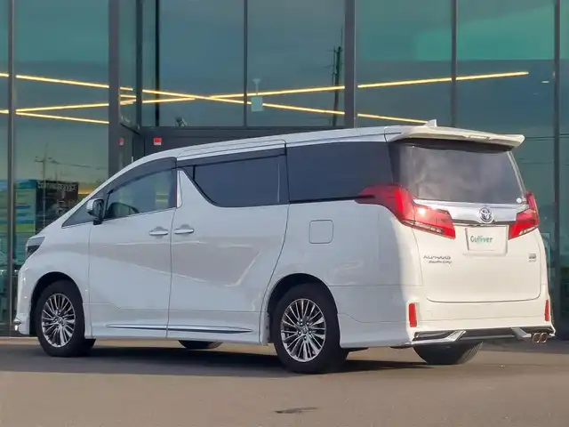 トヨタ アルファードハイブリット エグゼクティブ ラウンジ S 東京都 2022(令4)年 1.6万km ホワイトパールクリスタルシャイン メモリナビ/バックカメラ/フリップダウンモニター/アイドリングストップ/ウィンカーミラー/オットマン/キャプテンシート/クルーズコントロール/サンルーフ/ドアバイザー/プッシュスタート/両側パワースライドドア/パワーバックドア/イージークローザー/ETC