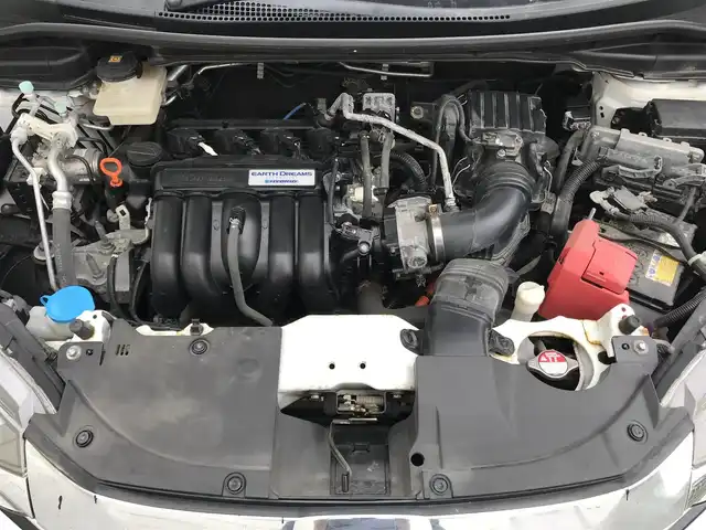 ホンダ シャトル ハイブリッド X ホンダセンシング 栃木県 2017(平29)年 8.9万km ホワイトオーキッドパール 株)IDOMが運営する【じしゃロン小山店】の自社ローン専用車両になります。こちらは現金またはオートローンご利用時の価格です。自社ローンご希望の方は別途その旨お申付け下さい//禁煙車/社外フルセグナビ/（CD/DVD/AM/FMラジオ）/(Bluetooth)/スマートキー/プッシュスタート/バックカメラ/クルーズコントロール/レーンキープアシスト/衝突軽減システム/シートヒーター/先行車発進告知/ステアリングリモコン/電動格納ドアミラー/パワーウインドウ/防眩ミラー/オートライト