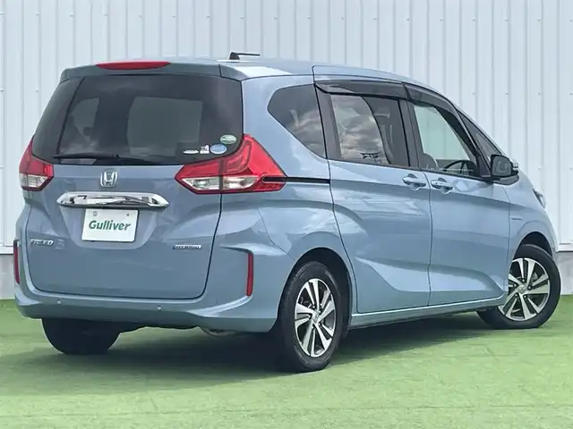 ホンダ フリード ハイブリット G ホンダセンシング 香川県 2020(令2)年 6.8万km シーグラスブルーパール ホンダセンシング/Sパッケージ/Cパッケージ/純正ナビ/バックカメラ/両側パワースライドドア/ハーフレザーシート/シートヒーター/革巻きステアリング/ステアリングリモコン/レーダークルーズ/LEDライト/リアロールサンシェード/スマートキー/プッシュスタート