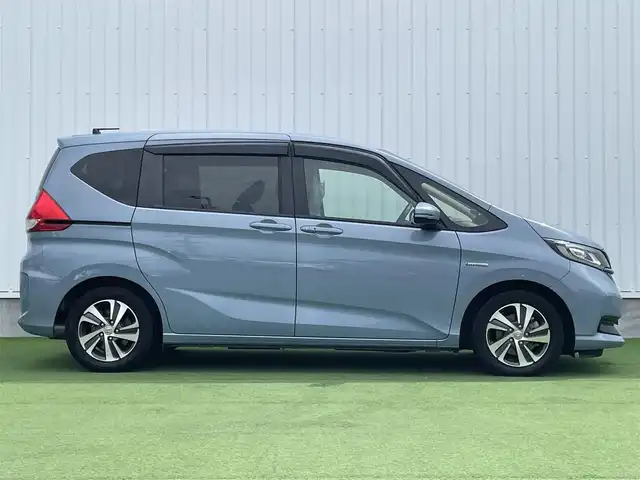 ホンダ フリード ハイブリット G ホンダセンシング 香川県 2020(令2)年 6.8万km シーグラスブルーパール ホンダセンシング/Sパッケージ/Cパッケージ/純正ナビ/バックカメラ/両側パワースライドドア/ハーフレザーシート/シートヒーター/革巻きステアリング/ステアリングリモコン/レーダークルーズ/LEDライト/リアロールサンシェード/スマートキー/プッシュスタート