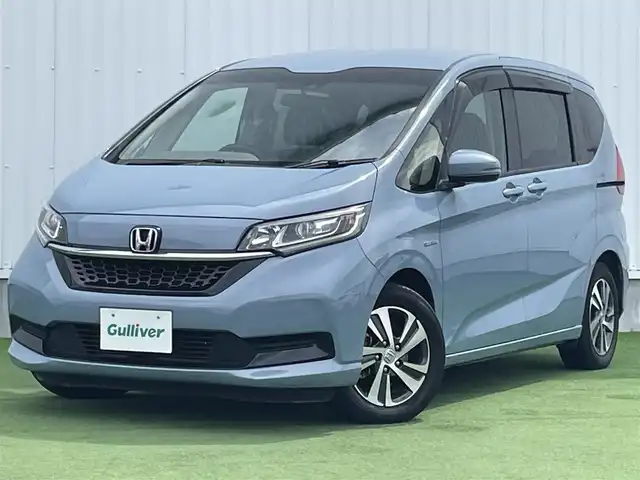 ホンダ フリード ハイブリット G ホンダセンシング 香川県 2020(令2)年 6.8万km シーグラスブルーパール ホンダセンシング/Sパッケージ/Cパッケージ/純正ナビ/バックカメラ/両側パワースライドドア/ハーフレザーシート/シートヒーター/革巻きステアリング/ステアリングリモコン/レーダークルーズ/LEDライト/リアロールサンシェード/スマートキー/プッシュスタート