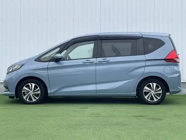 ホンダ フリード ハイブリット G ホンダセンシング 香川県 2020(令2)年 6.8万km シーグラスブルーパール ホンダセンシング/Sパッケージ/Cパッケージ/純正ナビ/バックカメラ/両側パワースライドドア/ハーフレザーシート/シートヒーター/革巻きステアリング/ステアリングリモコン/レーダークルーズ/LEDライト/リアロールサンシェード/スマートキー/プッシュスタート