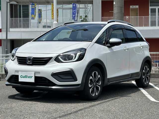 ホンダ フィット e:HEVクロスター 長崎県 2020(令2)年 4.6万km プラチナホワイトパール 純正HDDナビ(BT/FM/AM/フルセグ/CD/DVD)/プッシュスタート/スマートキー/スペアキー(1本)/渋滞追従機能付アダプティブクルーズコントロール/ナビ連動型ドラレコ/ビルトインETC/ステアリングスイッチ/純正フロアマット/純正16インチアルミホイール/ABS/VSA/LKAS/踏み間違い衝突軽減システム/CMBS/オートライト/パーキングセンサーシステム/SRSダブル・サイドエアバッグ/SRSカーテンエアバッグ/ISOFIX/イモビライザーシステム/取扱説明書/保証書/記録簿