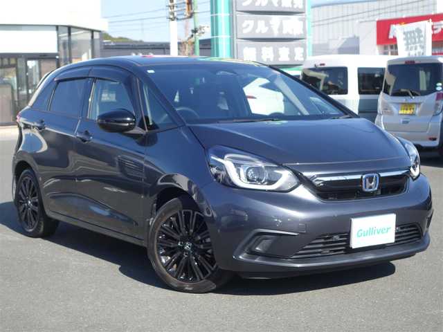 ホンダ フィット e:HEVホーム カーサ 熊本県 2021(令3)年 5.9万km メテオロイドグレーメタリック ワンオーナー/ホンダセンシング/純正Gathersディスプレイオーディオ/　CD/BT/USB/iPod/ワンセグTV/バックカメラ/ETC/純正ドライブレコーダー/前席シートヒーター/前後コーナーセンサー/純正ブラッククリア塗装16インチAW/プッシュスタート/スマートキー/純正フロアマット/純正ドアバイザー/保証書