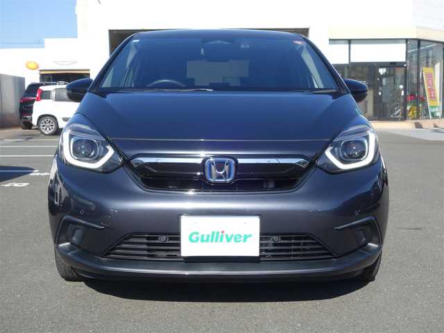 ホンダ フィット e:HEVホーム カーサ 熊本県 2021(令3)年 5.9万km メテオロイドグレーメタリック ワンオーナー/ホンダセンシング/純正Gathersディスプレイオーディオ/　CD/BT/USB/iPod/ワンセグTV/バックカメラ/ETC/純正ドライブレコーダー/前席シートヒーター/前後コーナーセンサー/純正ブラッククリア塗装16インチAW/プッシュスタート/スマートキー/純正フロアマット/純正ドアバイザー/保証書