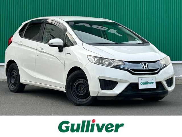 ホンダ フィット ハイブリット Fパッケージ 宮城県 2015(平27)年 15.3万km プレミアムホワイトパール 社外SDメモリーナビ/・Bluetooth/・ワンセグTV/・CD/DVD/ETC/バックカメラ/コーナーセンサー/横滑り防止装置/オートライト/電動格納ミラー/純正フロアマット/オートエアコン/盗難防止装置/ドアバイザー/アイドリングストップ/プッシュスタート＆スペアキー