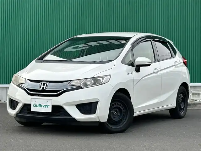 ホンダ フィット ハイブリット Fパッケージ 宮城県 2015(平27)年 15.3万km プレミアムホワイトパール 社外SDメモリーナビ/・Bluetooth/・ワンセグTV/・CD/DVD/ETC/バックカメラ/コーナーセンサー/横滑り防止装置/オートライト/電動格納ミラー/純正フロアマット/オートエアコン/盗難防止装置/ドアバイザー/アイドリングストップ/プッシュスタート＆スペアキー