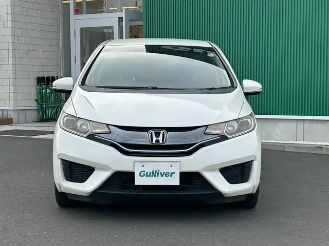 ホンダ フィット ハイブリット Fパッケージ 宮城県 2015(平27)年 15.3万km プレミアムホワイトパール 社外SDメモリーナビ/・Bluetooth/・ワンセグTV/・CD/DVD/ETC/バックカメラ/コーナーセンサー/横滑り防止装置/オートライト/電動格納ミラー/純正フロアマット/オートエアコン/盗難防止装置/ドアバイザー/アイドリングストップ/プッシュスタート＆スペアキー