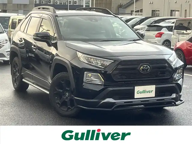 トヨタ ＲＡＶ４ アドベンチャー オフロードPKG 島根県 2021(令3)年 2.7万km アティチュードブラックマイカ 4WD/社外９型ナビ(ALPINE)　/(AM/FM/フルセグTV/ＤＶＤ再生/Ｂｌｕｅｔｏｏｔｈ接続)　/前後ドライブレコーダー　/ＥＴＣ　/バックカメラ　/レーダークルーズコントロール　/前後コーナーセンサー　/レーンアシスト/プリクラッシュセーフティ/レザーシート(黒)　/運転席パワーシート/電動パーキングブレーキ/オートホールド　/オートハイビーム／ライト　/純正ＬＥＤライト/純正18インチアルミホイール/純正フロアマット/スペアキー1本