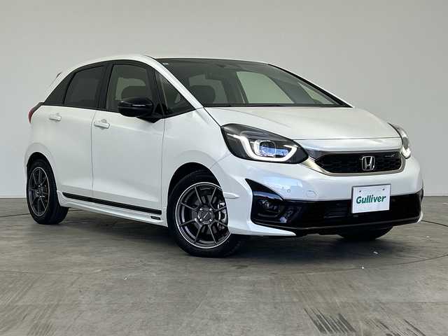 ホンダ フィット e:HEVモデューロX 三重県 2022(令4)年 2.8万km プラチナホワイトパール /禁煙車//純正ナビ/（CD.DVD.SD.BT.フルセグTV）//バックカメラ//ホンダセンシング//レーダークルーズコントロール//社外デジタルインナーミラー（ドラレコ機能付き）//コーナーセンサー//ハーフレザーシート//シートヒーター//ETC//モデューロアルミホイール//柿本マフラー