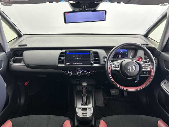 ホンダ フィット e:HEVモデューロX 三重県 2022(令4)年 2.8万km プラチナホワイトパール /禁煙車//純正ナビ/（CD.DVD.SD.BT.フルセグTV）//バックカメラ//ホンダセンシング//レーダークルーズコントロール//社外デジタルインナーミラー（ドラレコ機能付き）//コーナーセンサー//ハーフレザーシート//シートヒーター//ETC//モデューロアルミホイール//柿本マフラー
