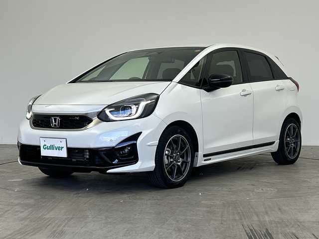 ホンダ フィット e:HEVモデューロX 三重県 2022(令4)年 2.8万km プラチナホワイトパール /禁煙車//純正ナビ/（CD.DVD.SD.BT.フルセグTV）//バックカメラ//ホンダセンシング//レーダークルーズコントロール//社外デジタルインナーミラー（ドラレコ機能付き）//コーナーセンサー//ハーフレザーシート//シートヒーター//ETC//モデューロアルミホイール//柿本マフラー