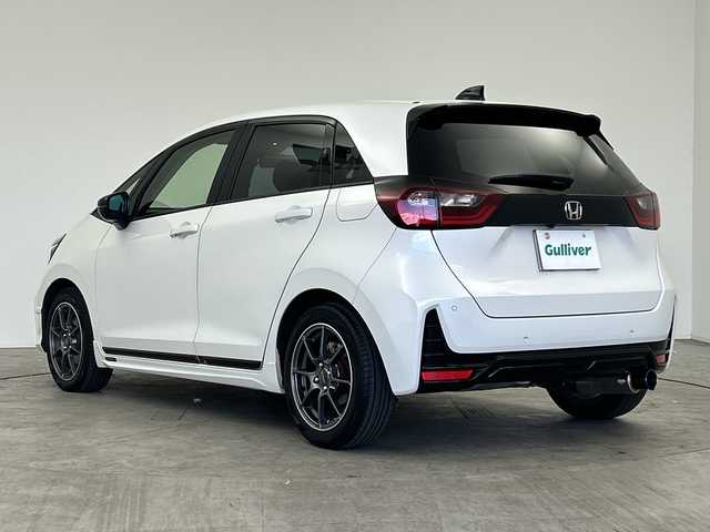 ホンダ フィット e:HEVモデューロX 三重県 2022(令4)年 2.8万km プラチナホワイトパール /禁煙車//純正ナビ/（CD.DVD.SD.BT.フルセグTV）//バックカメラ//ホンダセンシング//レーダークルーズコントロール//社外デジタルインナーミラー（ドラレコ機能付き）//コーナーセンサー//ハーフレザーシート//シートヒーター//ETC//モデューロアルミホイール//柿本マフラー