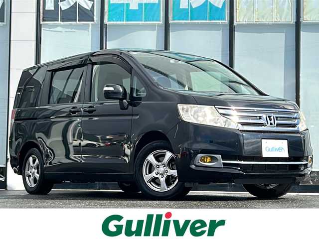 ホンダ ステップワゴン G Eセレクション 山形県 2014(平26)年 6.8万km クリスタルブラックパール 禁煙車/4WD/クルーズコントロール/寒冷地仕様/横滑り防止装置/両側パワースライドドア/純正ナビ/（Bluetooth/CD/DVD/フルセグ)/バックカメラ/フォグランプ/ステアリングスイッチ/後席モニター(TR-M70WS5)/ビルトインETC/社外AW/純正フロアマット/純正ホイールキャップスタドレス(205/65/R15・6mm)/  4本積載/電動格納ウィンカーミラー/ドアバイザー