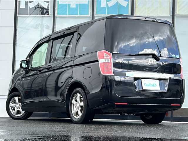 ホンダ ステップワゴン G Eセレクション 山形県 2014(平26)年 6.8万km クリスタルブラックパール 禁煙車/4WD/クルーズコントロール/寒冷地仕様/横滑り防止装置/両側パワースライドドア/純正ナビ/（Bluetooth/CD/DVD/フルセグ)/バックカメラ/フォグランプ/ステアリングスイッチ/後席モニター(TR-M70WS5)/ビルトインETC/社外AW/純正フロアマット/純正ホイールキャップスタドレス(205/65/R15・6mm)/  4本積載/電動格納ウィンカーミラー/ドアバイザー