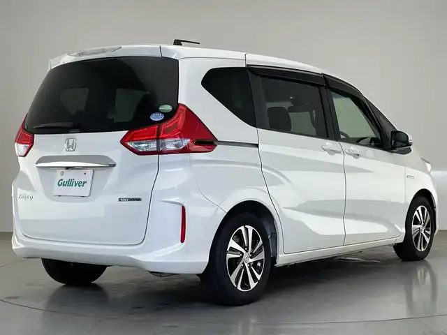 ホンダ フリード ハイブリット EX 愛知県 2018(平30)年 2.1万km ホワイトオーキッドパール 純正ナビ　フルセグＴＶ　Ｂｌｕｅｔｏｏｔｈ　ＵＳＢ　シートヒーター　両側パワースライドドア　ホンダセンシング　衝突軽減装置　追従クルコン　ハンドル支援　ＬＥＤオートライト　バックカメラ　ＥＴＣ　禁煙車