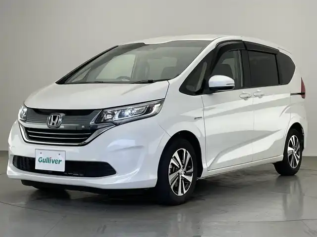 ホンダ フリード ハイブリット EX 愛知県 2018(平30)年 2.1万km ホワイトオーキッドパール 純正ナビ　フルセグＴＶ　Ｂｌｕｅｔｏｏｔｈ　ＵＳＢ　シートヒーター　両側パワースライドドア　ホンダセンシング　衝突軽減装置　追従クルコン　ハンドル支援　ＬＥＤオートライト　バックカメラ　ＥＴＣ　禁煙車