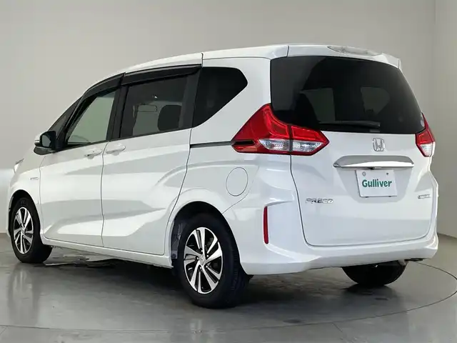 ホンダ フリード ハイブリット EX 愛知県 2018(平30)年 2.1万km ホワイトオーキッドパール 純正ナビ　フルセグＴＶ　Ｂｌｕｅｔｏｏｔｈ　ＵＳＢ　シートヒーター　両側パワースライドドア　ホンダセンシング　衝突軽減装置　追従クルコン　ハンドル支援　ＬＥＤオートライト　バックカメラ　ＥＴＣ　禁煙車