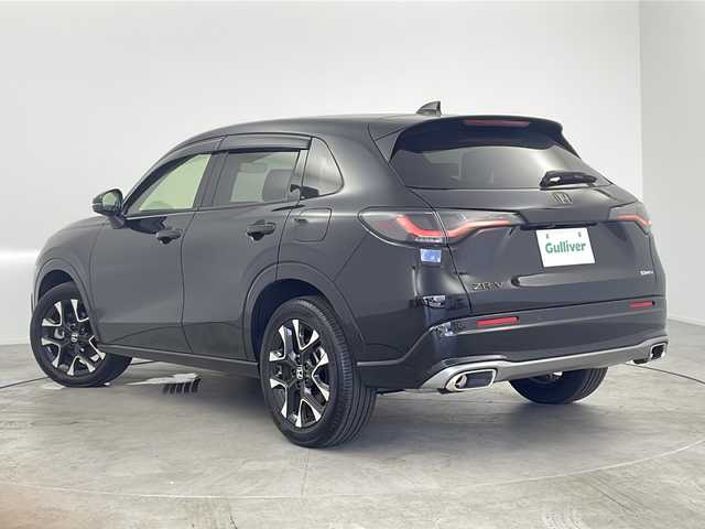 ホンダ ＺＲ－Ｖ ハイブリッド e:HEV Z 愛知県 2023(令5)年 0.7万km クリスタルブラックパール /禁煙車//純正HondaCONNECTディスプレイ//フルセグTV//ビルトインETC2.0//マルチビューカメラシステム//バックカメラ//本革シート//前席パワーシート・シートヒーター//運転席ポジションメモリー//BOSEプレミアムサウンドシステム//ハンズフリーパワーテールゲート//ホンダセンシング//衝突軽減ブレーキ(CMBS)//先行車発進お知らせ//歩行者事故低減ステアリング//路外逸脱抑制機能//標識認識機能//アダプティブクルーズコントロール//レーンキープアシストシステム//トラフィックジャムアシスト//誤発進抑制機能(前後方)//前後パーキングセンサー//オートハイビーム//アダプティブドライビングビーム//LEDヘッドライト//オートライト//ワイヤレス充電器//純正18インチアルミホイール(切削+ベルリナブラック塗装)//革巻きステアリング//ステアリングスイッチ//ステアリングヒーター//パドルシフト//純正フロアマット//純正ドアバイザー//プッシュスタート//電動格納ミラーウィンカー//横滑り防止装置