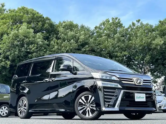 トヨタ ヴェルファイア Z Gエディション 宮崎県 2018(平30)年 2.6万km ブラック 純正SDナビ（NSZN-Z68T）/・Bluetoothオーディオ/USBオーディオ/・フルセグTV/SDオーディオ/バックカメラ/ツインムーンルーフ/三眼LEDヘッドランプ/・アダプティブハイビームシステム/後席用モニター/デジタルインナーミラー/パワーシート/シートヒーター/エアシート（前席）/パワーバックドア/両側パワースライドドア/ビルトインETC2.0/前後ドライブレコーダー（HDR963GW）/取扱説明書/保証書/スペアキー1本
