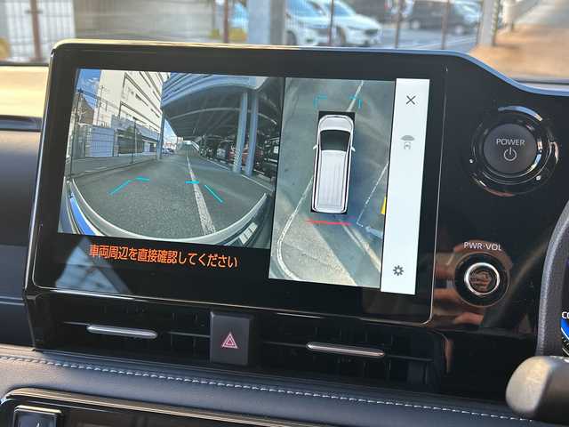 トヨタ ノア ハイブリッド Z 広島県 2023(令5)年 5.7万km アティチュードブラックマイカ 禁煙車/トヨタセーフティセンス/・プリクラッシュセーフティ/・オートマチックハイビーム/・LDA/LTA/・RSA/・レーダークルーズコントロール/・先行車発進告知/・ドライバー異常時対応システム/トヨタチームメイト（アドバンストパーク）/BSM/クリアランスソナー/10.5インチディスプレイオーディオPlus/・フルセグ/Bluetooth/CD/DVD/HDMI/USB/スマホ連携/パノラミックビューモニター/両側パワースライドドア/革巻きステアリング/ステアリングスイッチ/オートライト/LEDヘッドライト/フォグランプ/ハーフレザーシート/前席シートヒーター/電動パーキングブレーキ/ブレーキホールド/AC100V1500W電源/TZ前後ドライブレコーダー/ETC２．０/純正フロアマット/純正ドアバイザー/16インチアルミホイール