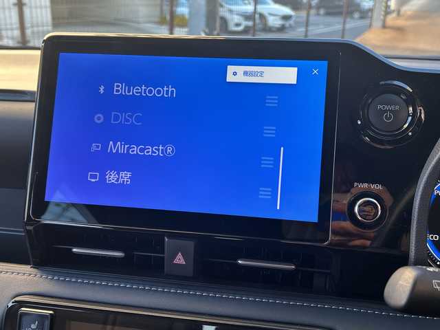 トヨタ ノア ハイブリッド Z 広島県 2023(令5)年 5.7万km アティチュードブラックマイカ 禁煙車/トヨタセーフティセンス/・プリクラッシュセーフティ/・オートマチックハイビーム/・LDA/LTA/・RSA/・レーダークルーズコントロール/・先行車発進告知/・ドライバー異常時対応システム/トヨタチームメイト（アドバンストパーク）/BSM/クリアランスソナー/10.5インチディスプレイオーディオPlus/・フルセグ/Bluetooth/CD/DVD/HDMI/USB/スマホ連携/パノラミックビューモニター/両側パワースライドドア/革巻きステアリング/ステアリングスイッチ/オートライト/LEDヘッドライト/フォグランプ/ハーフレザーシート/前席シートヒーター/電動パーキングブレーキ/ブレーキホールド/AC100V1500W電源/TZ前後ドライブレコーダー/ETC２．０/純正フロアマット/純正ドアバイザー/16インチアルミホイール