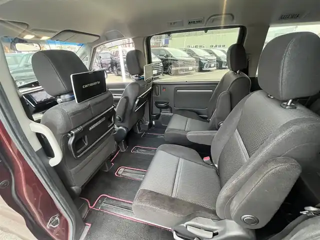 ホンダ ステップワゴン スパーダ ホンダセンシング 愛媛県 2017(平29)年 8.4万km プレミアムディープロッソパール 社外ナビ/BT/AM・FM/CD/DVD/フルセグTV/２列目リアモニター/ETC/ホンダセンシング/バックカメラ/追従型クルーズコントロール/レーンキープアシスト/両側パワースライドドア/アイドリングストップ/３列シート/オートライト/リモコンエンジンスターター/ステアリングスイッチ/ハンズフリー/純正アルミホイール/社外フロアマット