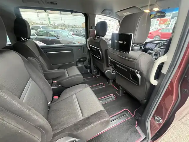 ホンダ ステップワゴン スパーダ ホンダセンシング 愛媛県 2017(平29)年 8.4万km プレミアムディープロッソパール 社外ナビ/BT/AM・FM/CD/DVD/フルセグTV/２列目リアモニター/ETC/ホンダセンシング/バックカメラ/追従型クルーズコントロール/レーンキープアシスト/両側パワースライドドア/アイドリングストップ/３列シート/オートライト/リモコンエンジンスターター/ステアリングスイッチ/ハンズフリー/純正アルミホイール/社外フロアマット