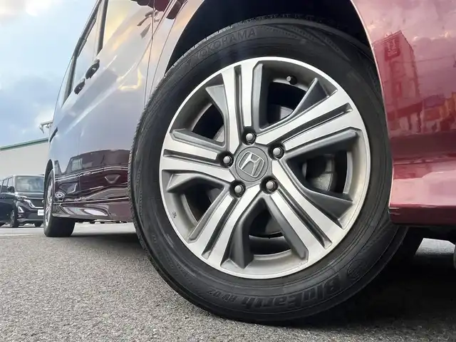 ホンダ ステップワゴン スパーダ ホンダセンシング 愛媛県 2017(平29)年 8.4万km プレミアムディープロッソパール 社外ナビ/BT/AM・FM/CD/DVD/フルセグTV/２列目リアモニター/ETC/ホンダセンシング/バックカメラ/追従型クルーズコントロール/レーンキープアシスト/両側パワースライドドア/アイドリングストップ/３列シート/オートライト/リモコンエンジンスターター/ステアリングスイッチ/ハンズフリー/純正アルミホイール/社外フロアマット