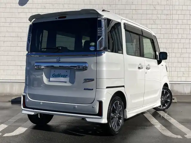 スズキ スペーシア カスタム HYBRID XS 静岡県 2018(平30)年 5.5万km ピュアホワイトP スズキセーフティサポート/社外7インチワイドナビ(CN-RE04WD)/　AM FM CD DVD Bluetooth SD/LEDオートヘッドライト/ハーフレザーシート/シートヒーター(運転席)/純正15インチアルミホイール/革巻きステアリング/ステアリングスイッチ/スマートキー2本/リアクリアランスソナー/リアサンシェード/フルセグTV/両側パワースライドドア