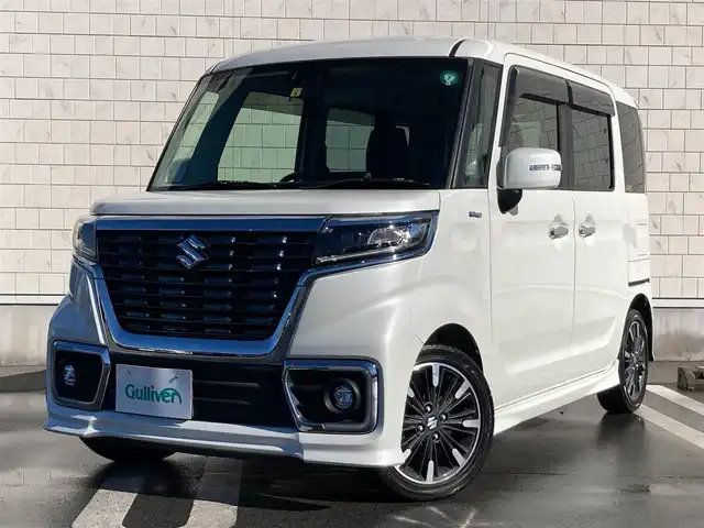 スズキ スペーシア カスタム HYBRID XS 静岡県 2018(平30)年 5.5万km ピュアホワイトP スズキセーフティサポート/社外7インチワイドナビ(CN-RE04WD)/　AM FM CD DVD Bluetooth SD/LEDオートヘッドライト/ハーフレザーシート/シートヒーター(運転席)/純正15インチアルミホイール/革巻きステアリング/ステアリングスイッチ/スマートキー2本/リアクリアランスソナー/リアサンシェード/フルセグTV/両側パワースライドドア