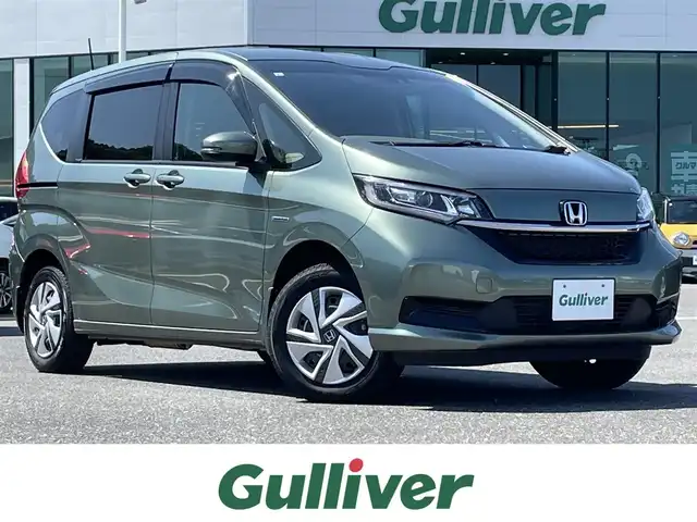 ホンダ フリード ハイブリット G ホンダセンシング 島根県 2021(令3)年 2.8万km シルバーミストグリーンM 純正ナビ/CD/DVD/DTV/Bluetooth/バックカメラ/両側パワースライドドア /レーダークルーズコントロール/純正ホイール付きサマータイヤ積込/LEDオートライト/前後ドライブレコーダー/ビルトインETC/フロントワイパーデアイサー /ステアリングスイッチ/スマートキー/スペアキー /純正フロアマット/ドアバイザー/コーナーセンサー