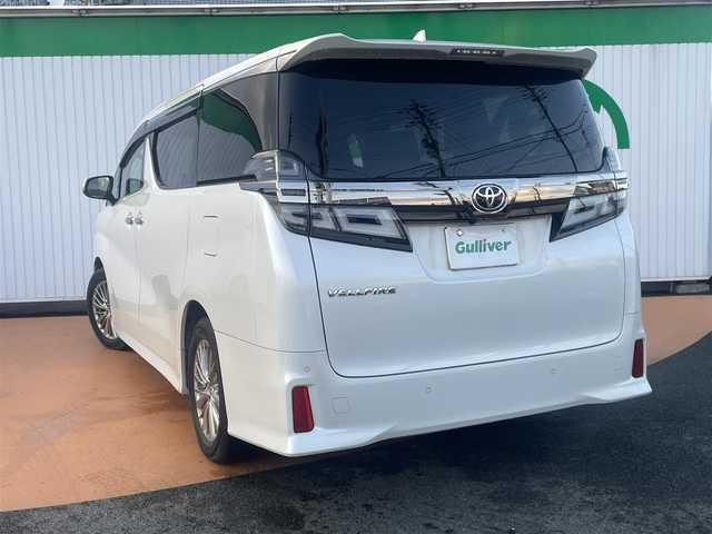 トヨタ ヴェルファイア Z 大分県 2018(平30)年 8.7万km ホワイトパールクリスタルシャイン アルパイン9インチメモリナビ/＊フルセグテレビ/Bluetooth/DVD/CD/AM/FM/バックカメラ/セーフティセンス/パワースライドドア（運転席側/助手席側）/LEDヘッドランプ/オートライト/アルパイン12インチフリップダウンモニター/ボディ同色電動オート格納ドアミラー/235/50R18タイヤ/　＊18インチアルミホイール/左右独立温度調整オートエアコン/ナノイー/スマートエントリー/プッシュスタート
