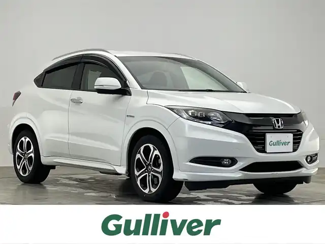 ホンダ ヴェゼル ハイブリッド Z 滋賀県 2014(平26)年 7.6万km ホワイトオーキッドパール 禁煙車/純正８インチナビ/　（Bluetooth・フルセグTV・DVD・CD・USB/ipod）/ETC/前方ドライブレコーダー/バックカメラ/クルーズコントロール/電動パーキングブレーキ/オートブレーキホールド/リアソナー/レーンキープアシスト/ハーフレザーシート/前席シートヒーター/LEDライト/オートライト/パドルシフト/プッシュスタート/スマートキー/ステアリングスイッチ