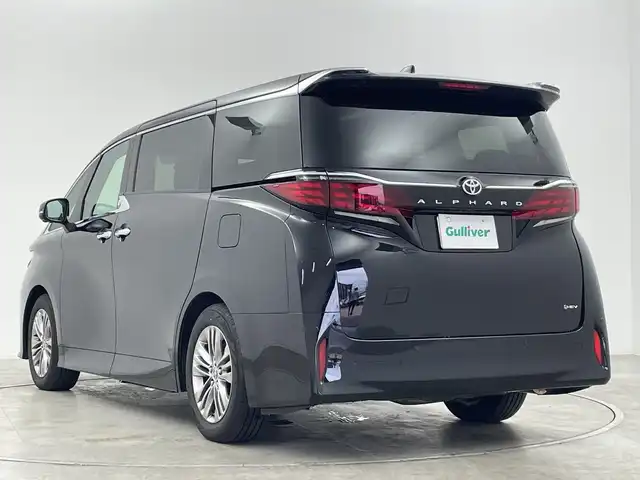 トヨタ アルファードハイブリット Z 群馬県 2025(令7)年 0.5万km ブラック 左右独立ムーンルーフ/トヨタセーフティセンス/PCS/アドバンスドドライブ/PDA/BSM/LDA/レーンチェンジアシスト/FCTA/PKSB/AHB/RSA/RCTA/安心降車アシスト/クリアランスソナー/HUD/純正１４インチナビ/Bluetooth/フルセグTV/AppleCarPlay/純正１２．１型後席モニター/全周囲カメラ/D/Nシートヒーター・エアシート/ハンドルヒーター/D/Nパワーシート/PRゲート/両サイドユニバーサルステップ/オートライト/LEDヘッドランプ・フォグランプ/電格ミラー/ウィンカーミラー/純正AW/ETC2.0/ワイヤレス充電/AC１００V/デジタルインナーミラー/レザーシート/革巻きステアリング/純正フロアマット/プッシュスタート/スマートキー