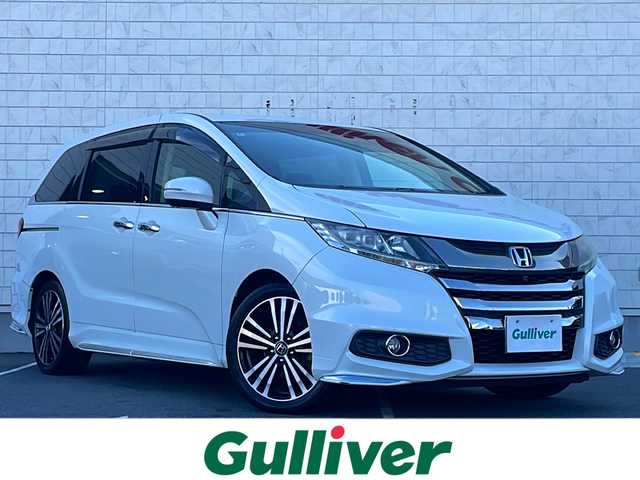 ホンダ オデッセイ アブソルート EX 長野県 2014(平26)年 7.1万km ホワイトオーキッドパール ・純正ナビ/・フルセグTV・Bluetooth/・純正フリップダウンモニター/・LEDルームランプ（1～3列目）/・LEDアウターウエルカムライト（リアドア〈左右〉）/・リア両側パワースライドドア/・コンフォートビューパッケージ/・トリプルゾーンコントロール・フルオートエアコンディショナー/・ブラインドスポットインフォメーション/・2列目大型ロールサンシェイド/・ABSOLUTE専用18インチアルミホイール（FF）/・LEDアクティブコーナリングライト/・運転席8ウェイパワーシート/・マルチインフォメーション・ディスプレイ/・あんしんパッケージ/・LEDヘッドライト+導光タイプLEDポジションランプ/・フォグライト/・大開口フロントグリル（ダーククロームメッキ）/・エアロダイナミクス・カラードバンパー（フロント/リア、クロームメッキモール付）/・エアロダイナミクス・ドアロアガーニッシュ（クロームメッキ調モール付）/・コンビシート（プライムスムース×ファブリック）/・本革巻ステアリングホイール/・パドルシフト/・ABSOLUTE専用チューニングサスペンション/・プッシュエンジンスタート/・保証書・取扱説明書・スペアキー