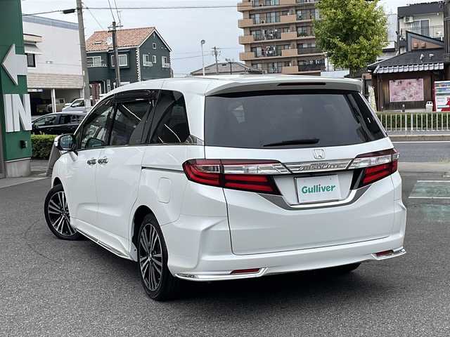 ホンダ オデッセイ アブソルート EX 長野県 2014(平26)年 7.1万km ホワイトオーキッドパール ・純正ナビ/・フルセグTV・Bluetooth/・純正フリップダウンモニター/・LEDルームランプ（1～3列目）/・LEDアウターウエルカムライト（リアドア〈左右〉）/・リア両側パワースライドドア/・コンフォートビューパッケージ/・トリプルゾーンコントロール・フルオートエアコンディショナー/・ブラインドスポットインフォメーション/・2列目大型ロールサンシェイド/・ABSOLUTE専用18インチアルミホイール（FF）/・LEDアクティブコーナリングライト/・運転席8ウェイパワーシート/・マルチインフォメーション・ディスプレイ/・あんしんパッケージ/・LEDヘッドライト+導光タイプLEDポジションランプ/・フォグライト/・大開口フロントグリル（ダーククロームメッキ）/・エアロダイナミクス・カラードバンパー（フロント/リア、クロームメッキモール付）/・エアロダイナミクス・ドアロアガーニッシュ（クロームメッキ調モール付）/・コンビシート（プライムスムース×ファブリック）/・本革巻ステアリングホイール/・パドルシフト/・ABSOLUTE専用チューニングサスペンション/・プッシュエンジンスタート/・保証書・取扱説明書・スペアキー