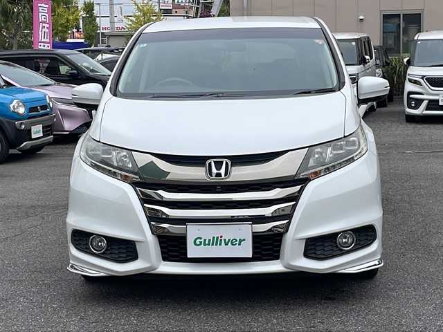 ホンダ オデッセイ アブソルート EX 長野県 2014(平26)年 7.1万km ホワイトオーキッドパール ・純正ナビ/・フルセグTV・Bluetooth/・純正フリップダウンモニター/・LEDルームランプ（1～3列目）/・LEDアウターウエルカムライト（リアドア〈左右〉）/・リア両側パワースライドドア/・コンフォートビューパッケージ/・トリプルゾーンコントロール・フルオートエアコンディショナー/・ブラインドスポットインフォメーション/・2列目大型ロールサンシェイド/・ABSOLUTE専用18インチアルミホイール（FF）/・LEDアクティブコーナリングライト/・運転席8ウェイパワーシート/・マルチインフォメーション・ディスプレイ/・あんしんパッケージ/・LEDヘッドライト+導光タイプLEDポジションランプ/・フォグライト/・大開口フロントグリル（ダーククロームメッキ）/・エアロダイナミクス・カラードバンパー（フロント/リア、クロームメッキモール付）/・エアロダイナミクス・ドアロアガーニッシュ（クロームメッキ調モール付）/・コンビシート（プライムスムース×ファブリック）/・本革巻ステアリングホイール/・パドルシフト/・ABSOLUTE専用チューニングサスペンション/・プッシュエンジンスタート/・保証書・取扱説明書・スペアキー