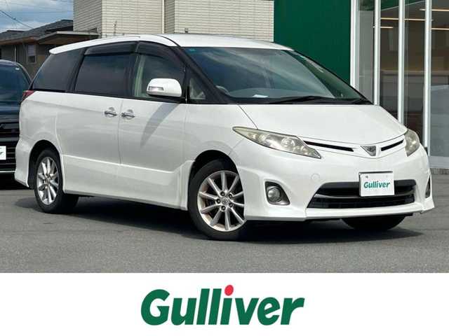 トヨタ エスティマ アエラス Gエディション 静岡県 2011(平23)年 11.6万km ホワイトパールクリスタルシャイン エンジンスタートボタン/パワーステアリング/パワーウィンドウ/スマートキー/オートエアコン/クルーズコントロール/純正ナビ（CD/BT/ワンセグ）/三列シート/オットマン/ドライブレコーダー/ウォークスルー/純正フロアマット/純正アルミホイール/両側パワースライドドア/ABS/オートライト/Wエアバック