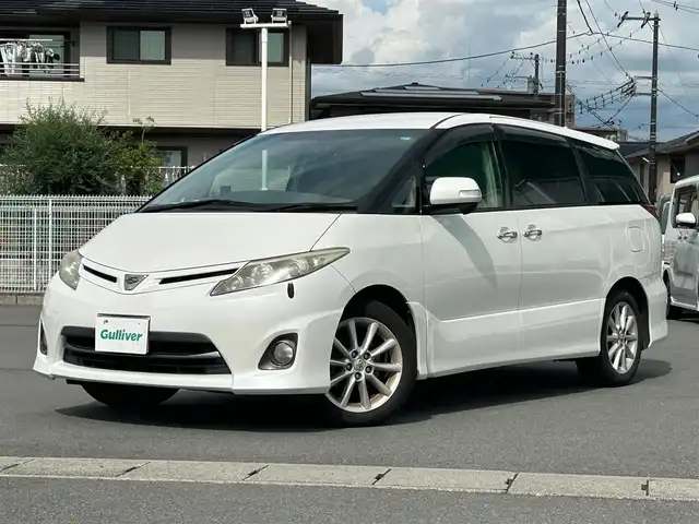 トヨタ エスティマ アエラス Gエディション 静岡県 2011(平23)年 11.6万km ホワイトパールクリスタルシャイン エンジンスタートボタン/パワーステアリング/パワーウィンドウ/スマートキー/オートエアコン/クルーズコントロール/純正ナビ（CD/BT/ワンセグ）/三列シート/オットマン/ドライブレコーダー/ウォークスルー/純正フロアマット/純正アルミホイール/両側パワースライドドア/ABS/オートライト/Wエアバック