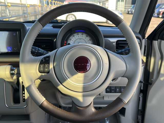 スズキ ラパン ＬＣ X 道東・釧路十勝 2023(令5)年 0.5万km フォーンベージュメタリック/アーバンブラウン 2トーン 純正ディスプレイオーディオ　/ＤＶＤ再生　/Ｂｌｕｅｔｏｏｔｈ接続　/バックカメラ　/前席シートヒーター　/リアコーナーセンサー　/レーンアシスト　/衝突軽減ブレーキ/横滑り防止装置/アイドリングストップ　/スマートキー　/プッシュスタート/純正LEDヘッドライト　/純正１４インチアルミホイール/純正フロアマット