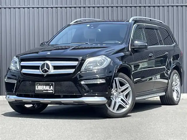 メルセデス・ベンツ ＧＬ５５０ 4MATIC AMGエクスクルーシブ 福島県 2013(平25)年 5.7万km オブシディアンブラック 左ハンドル/ＡＭＧエクスクルーシブパッケージ /・パノラミックスライディングルーフ＆３列目ガラスルーフ/・本革巻ウッドステアリング/・前席シートベンチション/・21インチ・ＡＭＧ５ツインスポークAW/・メルセデスベンツロゴ付ブレーキキャリパー/アダプティブクルーズコントロール/ブラインドスポットモニター/レーンキープアシスト/インテリジェントライト/白レザーシート/前席メモリ付パワーシート/全席シートヒーター/パワーリアゲート/純正HDDナビ(BT/USB/CD/DVD)/フルセグTV/360°カメラ/バックカメラ/ダウンヒルコントロール/サイドステップ/純正エアサスペンション/ルーフレール/ドアバイザー/積み込み冬タイヤ19AW/取扱説明書/保証書